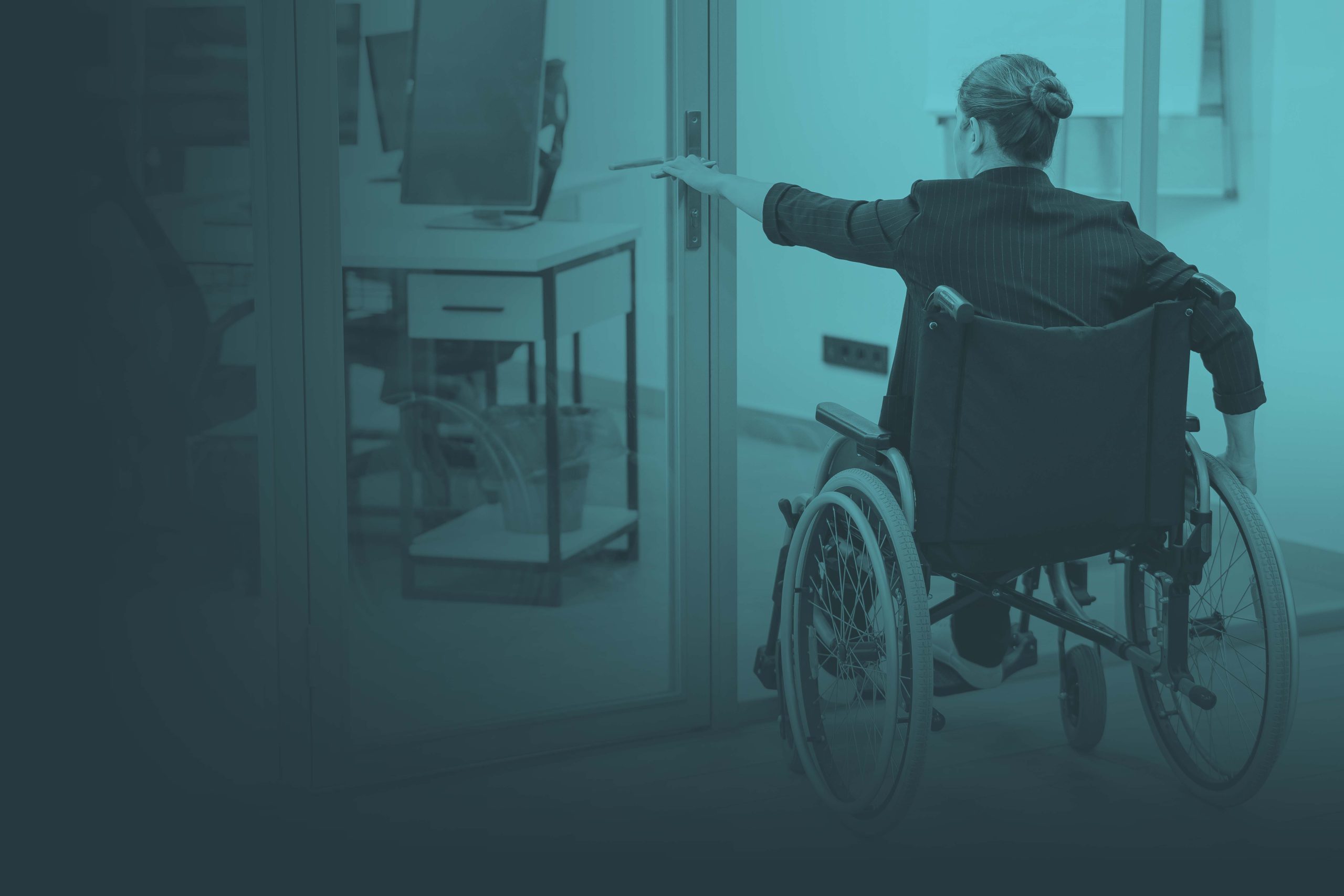 Woman using wheelchair to get into office