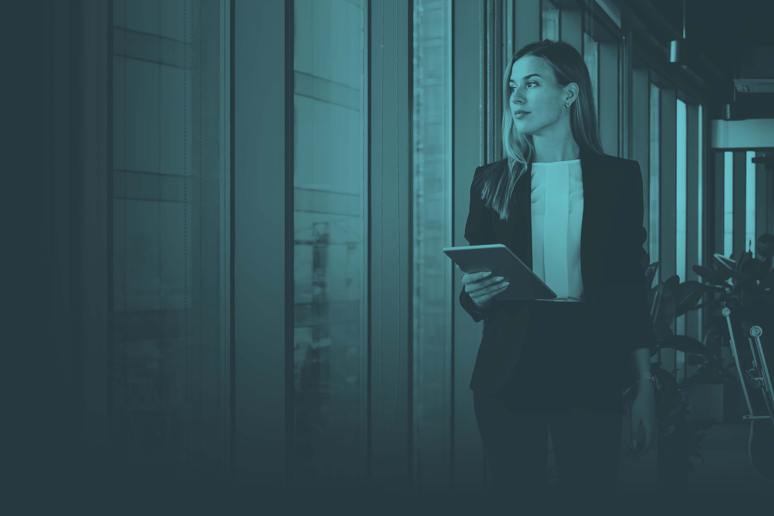 Young woman walking into work with tablet