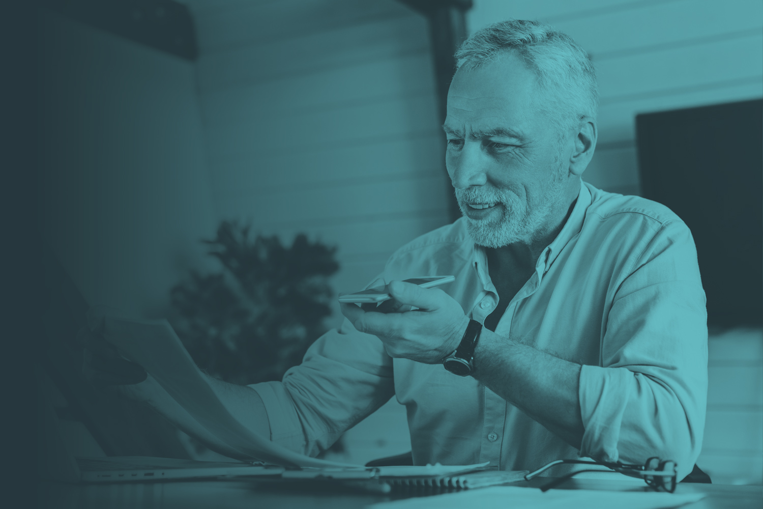 Male employee talking on phone