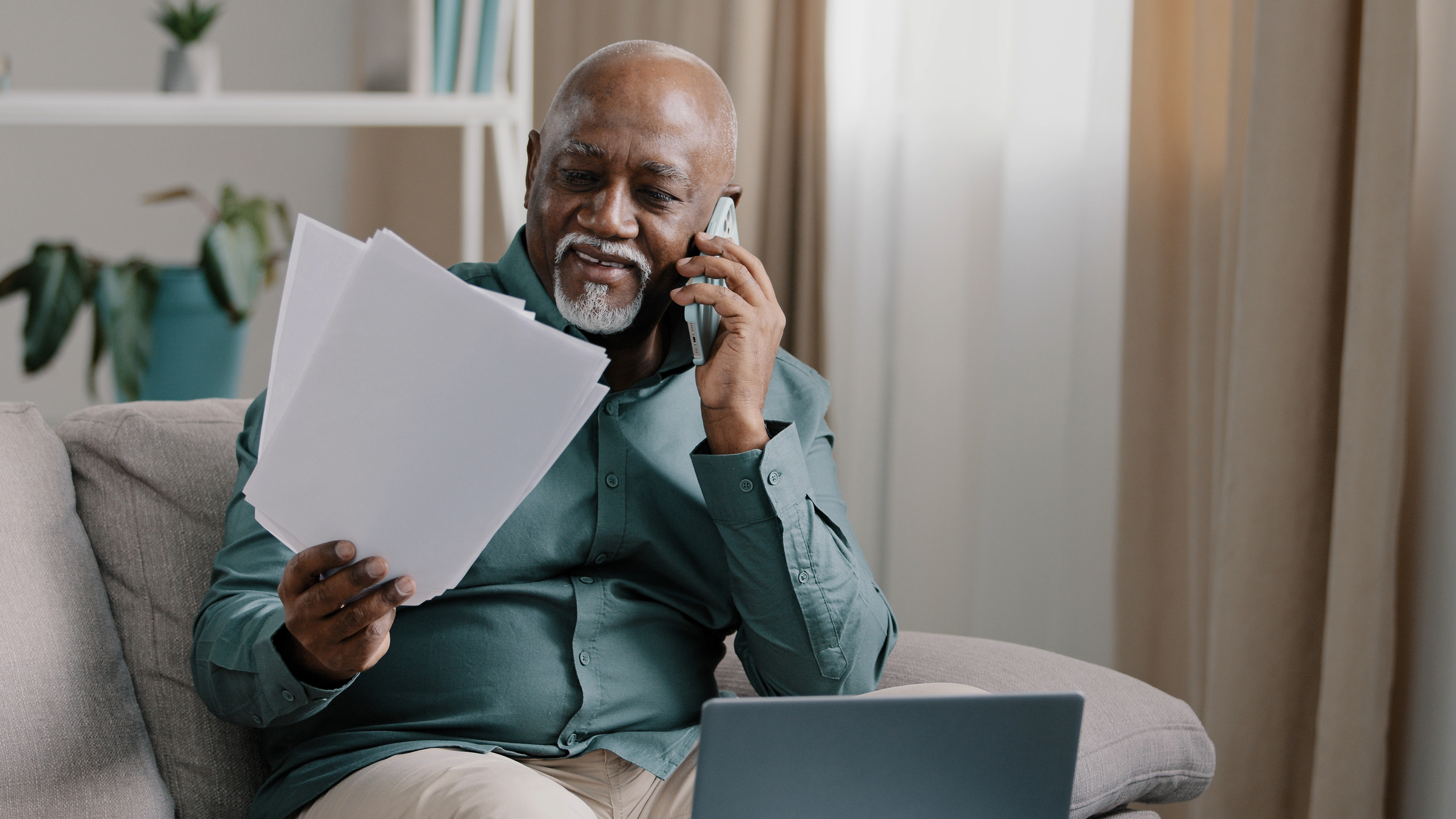 A New York office worker checks documents that contain details about his experience with age discrimination in the office as he prepares a complaint to the EEOC.
