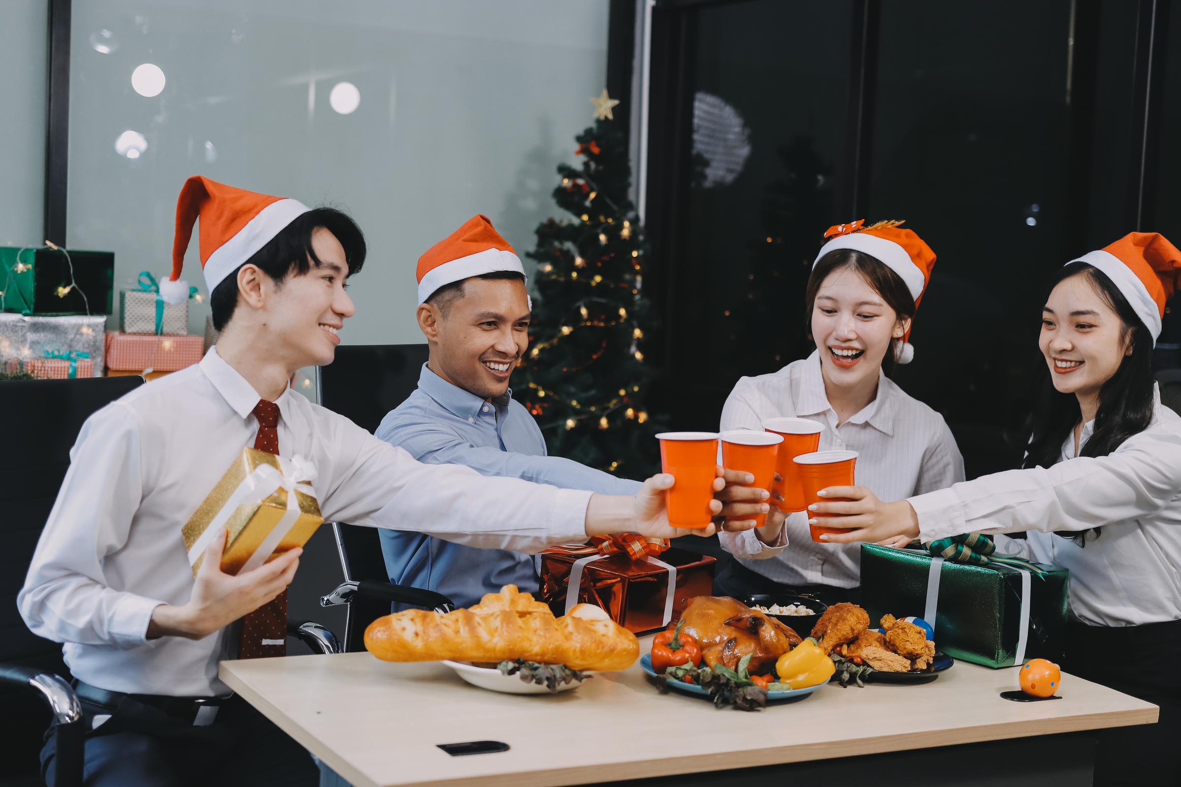 Office workers celebrate at their office Christmas party, a protected holiday.