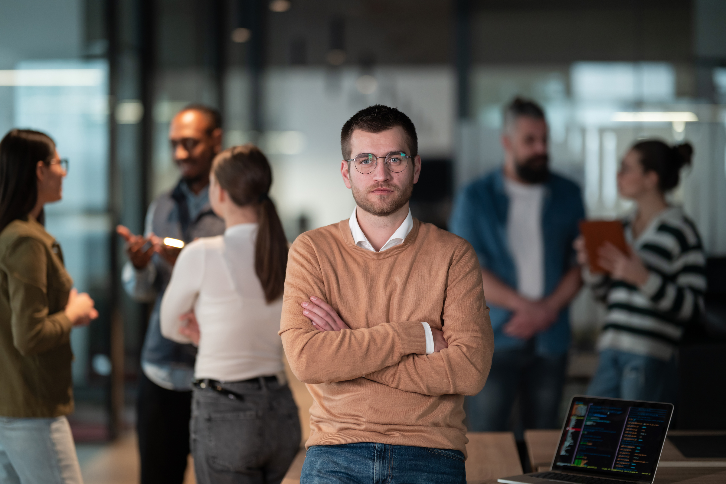 A New York City office worker broods as he is being excluded from business decisions. Is it discrimination or is management