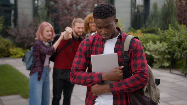 A man is excluded from his coworkers' activities, an act of subtle racial discrimination, giving him an opportunity to pursue legal action against them.